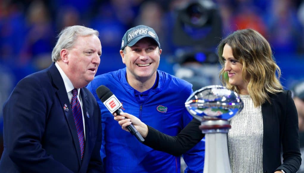 University of Florida head coach Dan Mullen accepts the Chick-fil-A Peach Bowl trophy after the Gators’ 41-15 win over Michigan- Florida Gators football- 1280x853