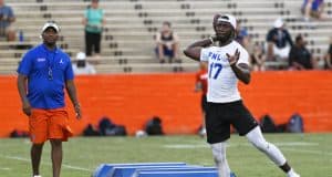 University of Florida quarterback Jalon Jones works out in front of quarterback coach Brian Johnson during Friday Night Lights- Florida Gators football- 1280x853