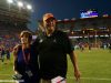 University of Florida defensive coordinator walks off the field with his wife Paige after the Florida Gators win over LSU- Florida Gators football- 1280x852