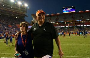 University of Florida defensive coordinator walks off the field with his wife Paige after the Florida Gators win over LSU- Florida Gators football- 1280x852