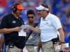 University of Florida defensive coordinator Todd Grantham and head coach Dan Mullen talk over a call in the LSU game - 1280x853