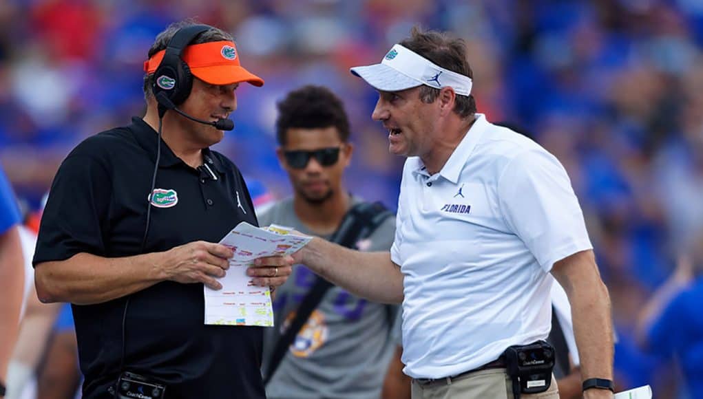 University of Florida defensive coordinator Todd Grantham and head coach Dan Mullen talk over a call in the LSU game - 1280x853