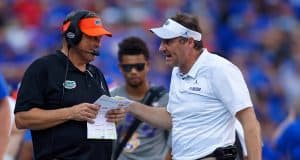 University of Florida defensive coordinator Todd Grantham and head coach Dan Mullen talk over a call in the LSU game - 1280x853