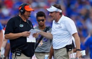 University of Florida defensive coordinator Todd Grantham and head coach Dan Mullen talk over a call in the LSU game - 1280x853