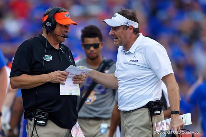 University of Florida defensive coordinator Todd Grantham and head coach Dan Mullen talk over a call in the LSU game - 1280x853