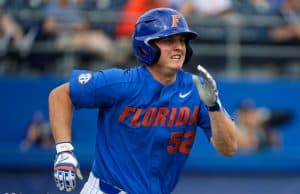 University of Florida junior Kirby McMullen runs out a ground ball against the Miami Hurricanes- Florida Gators baseball- 1280x853