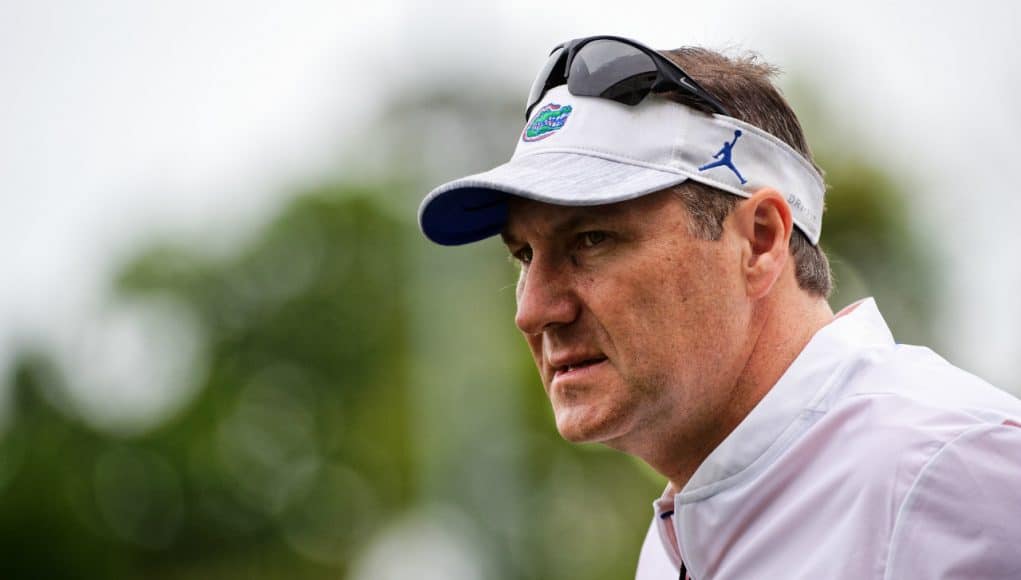 University of Florida head coach Dan Mullen looks on as his team practice during spring camp- Florida Gators football- 1280x853