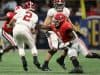 Dec 1, 2018; Atlanta, GA, USA; Alabama Crimson Tide quarterback Jalen Hurts (2) gets by the tackle attempt by Georgia Bulldogs linebacker Brenton Cox (1) in the SEC championship game at Mercedes-Benz Stadium. Mandatory Credit: Jason Getz-USA TODAY Sports