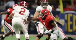 Dec 1, 2018; Atlanta, GA, USA; Alabama Crimson Tide quarterback Jalen Hurts (2) gets by the tackle attempt by Georgia Bulldogs linebacker Brenton Cox (1) in the SEC championship game at Mercedes-Benz Stadium. Mandatory Credit: Jason Getz-USA TODAY Sports