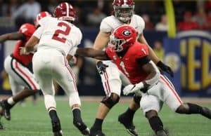Dec 1, 2018; Atlanta, GA, USA; Alabama Crimson Tide quarterback Jalen Hurts (2) gets by the tackle attempt by Georgia Bulldogs linebacker Brenton Cox (1) in the SEC championship game at Mercedes-Benz Stadium. Mandatory Credit: Jason Getz-USA TODAY Sports