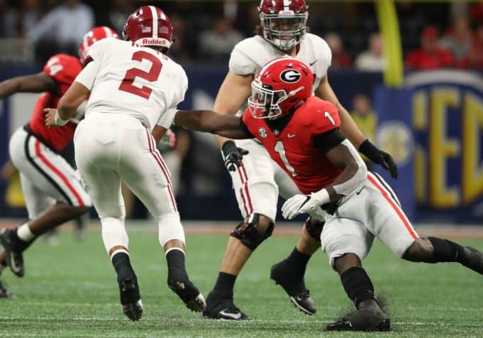 Dec 1, 2018; Atlanta, GA, USA; Alabama Crimson Tide quarterback Jalen Hurts (2) gets by the tackle attempt by Georgia Bulldogs linebacker Brenton Cox (1) in the SEC championship game at Mercedes-Benz Stadium. Mandatory Credit: Jason Getz-USA TODAY Sports