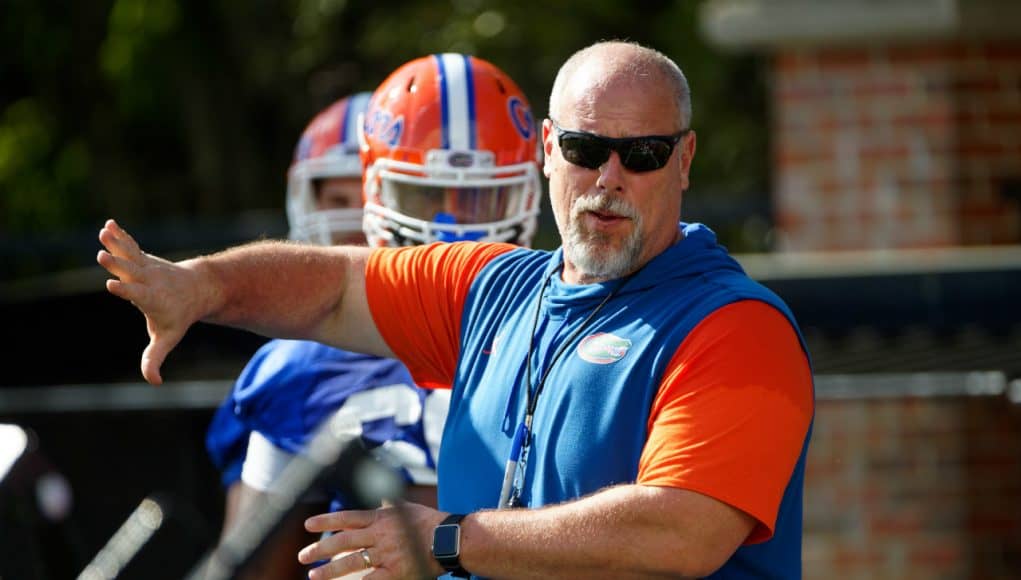 University of Florida offensive line coach John Hevesy teaching before a drill in spring camp- Florida Gators football- 1280x853