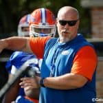 University of Florida offensive line coach John Hevesy teaching before a drill in spring camp- Florida Gators football- 1280x853