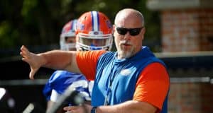 University of Florida offensive line coach John Hevesy teaching before a drill in spring camp- Florida Gators football- 1280x853