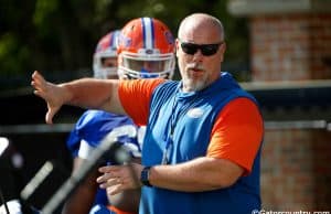 University of Florida offensive line coach John Hevesy teaching before a drill in spring camp- Florida Gators football- 1280x853