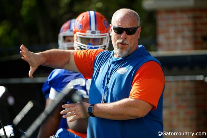 University of Florida offensive line coach John Hevesy teaching before a drill in spring camp- Florida Gators football- 1280x853