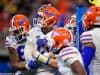 University of Florida quarterback Feleipe Franks is mobbed by teammates after scoring a touchdown against Michigan in the Peach Bowl- Florida Gators football- 1280x853