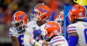 University of Florida quarterback Feleipe Franks is mobbed by teammates after scoring a touchdown against Michigan in the Peach Bowl- Florida Gators football- 1280x853