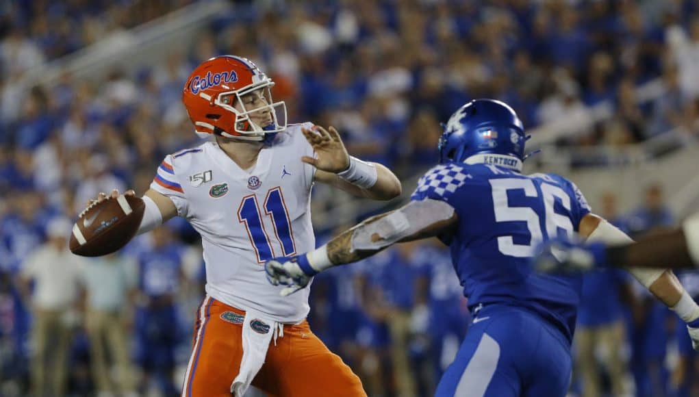 Sep 14, 2019; Lexington, KY, USA; Florida Gators quarterback Kyle Trask (11) passes the ball against the Kentucky Wildcats linebacker Kash Daniel (56) in the 3rd quarter at Kroger Field. Mandatory Credit: Mark Zerof-USA TODAY Sports