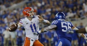 Sep 14, 2019; Lexington, KY, USA; Florida Gators quarterback Kyle Trask (11) passes the ball against the Kentucky Wildcats linebacker Kash Daniel (56) in the 3rd quarter at Kroger Field. Mandatory Credit: Mark Zerof-USA TODAY Sports