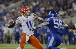 Sep 14, 2019; Lexington, KY, USA; Florida Gators quarterback Kyle Trask (11) passes the ball against the Kentucky Wildcats linebacker Kash Daniel (56) in the 3rd quarter at Kroger Field. Mandatory Credit: Mark Zerof-USA TODAY Sports