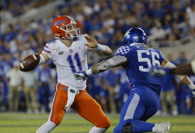 Sep 14, 2019; Lexington, KY, USA; Florida Gators quarterback Kyle Trask (11) passes the ball against the Kentucky Wildcats linebacker Kash Daniel (56) in the 3rd quarter at Kroger Field. Mandatory Credit: Mark Zerof-USA TODAY Sports