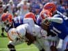 University of Florida defensive players gang tackle a Tennessee receiver in a 34-3 win over the Volunteers- Florida Gators football- 1280x853