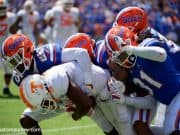 University of Florida defensive players gang tackle a Tennessee receiver in a 34-3 win over the Volunteers- Florida Gators football- 1280x853