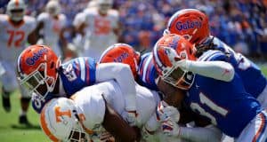 University of Florida defensive players gang tackle a Tennessee receiver in a 34-3 win over the Volunteers- Florida Gators football- 1280x853