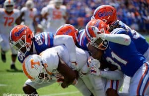 University of Florida defensive players gang tackle a Tennessee receiver in a 34-3 win over the Volunteers- Florida Gators football- 1280x853
