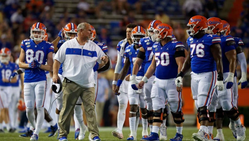 University of Florida offensive line coach John Hevesy talks to the Florida Gators offensive line between drives- Florida Gators football- 1280x853