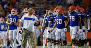 University of Florida offensive line coach John Hevesy talks to the Florida Gators offensive line between drives- Florida Gators football- 1280x853