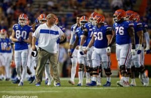University of Florida offensive line coach John Hevesy talks to the Florida Gators offensive line between drives- Florida Gators football- 1280x853