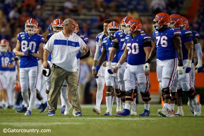University of Florida offensive line coach John Hevesy talks to the Florida Gators offensive line between drives- Florida Gators football- 1280x853
