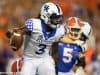 University of Kentucky quarterback Terry Wilson scrambles for a first down against the Florida Gators- Florida Gators football- 1280x853