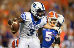 University of Kentucky quarterback Terry Wilson scrambles for a first down against the Florida Gators- Florida Gators football- 1280x853