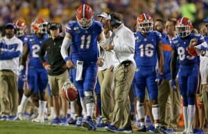 Oct 12, 2019; Baton Rouge, LA, USA; Florida Gators head coach Dan Mullen talks to quarterback Kyle Trask (11) in the first quarter of their game against the LSU Tigers at Tiger Stadium. Mandatory Credit: Chuck Cook-USA TODAY Sports