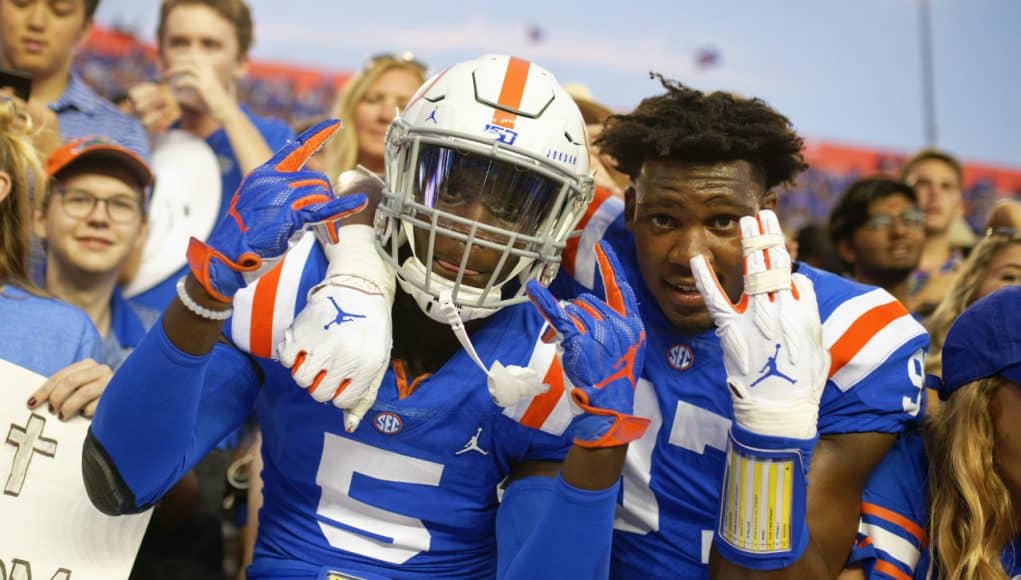 University of Florida freshmen Kaiir Elam and Khris Bogle celebrate with fans after the Gators win over Auburn in 2019- Florida Gators football- 1280x853