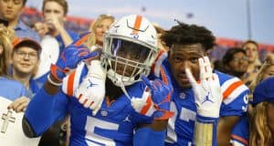 University of Florida freshmen Kaiir Elam and Khris Bogle celebrate with fans after the Gators win over Auburn in 2019- Florida Gators football- 1280x853