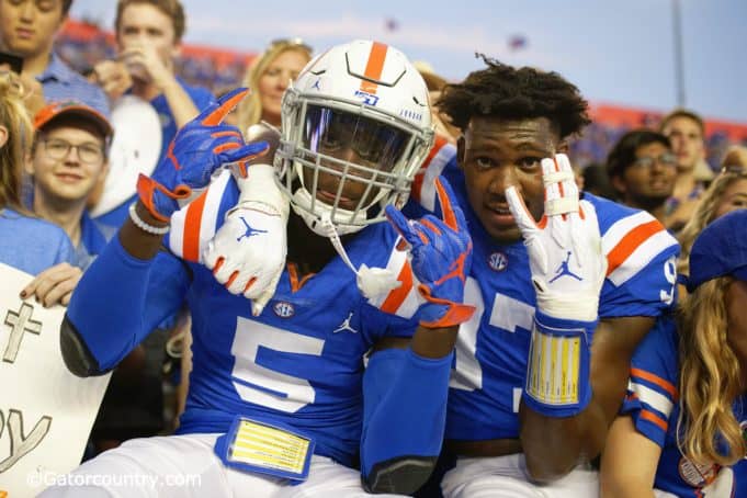 University of Florida freshmen Kaiir Elam and Khris Bogle celebrate with fans after the Gators win over Auburn in 2019- Florida Gators football- 1280x853