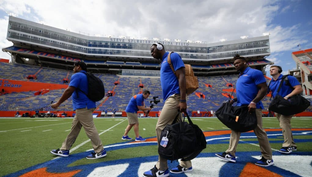 University of Florida players cross midfield during Gator walk before playing the Towson Tigers- Florida Gators football- 1280x853