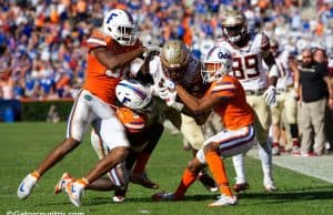 University of Florida Gators defensive back Shawn Davis cornerback Marco Wilson combine for a tackle in a loss to FSU- Florida Gators football- 1280x853