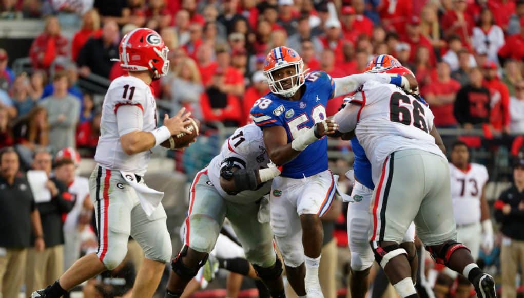 University of Florida defensive end Jon Greenard gets through the Georgia offensive line in pursuit of Jake Fromm- Florida Gators football- 1280x853