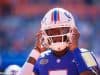 University of Florida quarterback Emory Jones puts his helmet on before entering the game against Vanderbilt- Florida Gators football- 1280x853