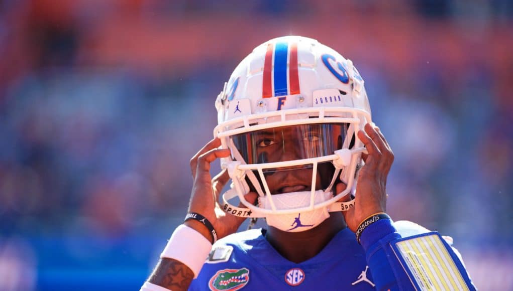 University of Florida quarterback Emory Jones puts his helmet on before entering the game against Vanderbilt- Florida Gators football- 1280x853