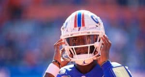 University of Florida quarterback Emory Jones puts his helmet on before entering the game against Vanderbilt- Florida Gators football- 1280x853