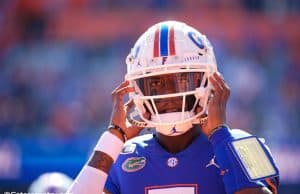 University of Florida quarterback Emory Jones puts his helmet on before entering the game against Vanderbilt- Florida Gators football- 1280x853