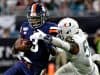 Oct 11, 2019; Miami Gardens, FL, USA; Virginia Cavaliers quarterback Bryce Perkins (3) is tackled by Miami Hurricanes linebacker Michael Pinckney (56) during the second half at Hard Rock Stadium. Mandatory Credit: Steve Mitchell-USA TODAY Sports