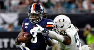 Oct 11, 2019; Miami Gardens, FL, USA; Virginia Cavaliers quarterback Bryce Perkins (3) is tackled by Miami Hurricanes linebacker Michael Pinckney (56) during the second half at Hard Rock Stadium. Mandatory Credit: Steve Mitchell-USA TODAY Sports