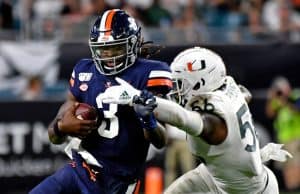 Oct 11, 2019; Miami Gardens, FL, USA; Virginia Cavaliers quarterback Bryce Perkins (3) is tackled by Miami Hurricanes linebacker Michael Pinckney (56) during the second half at Hard Rock Stadium. Mandatory Credit: Steve Mitchell-USA TODAY Sports